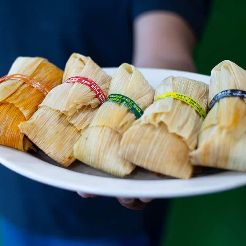 City Tamale tamales arranged on a white plate